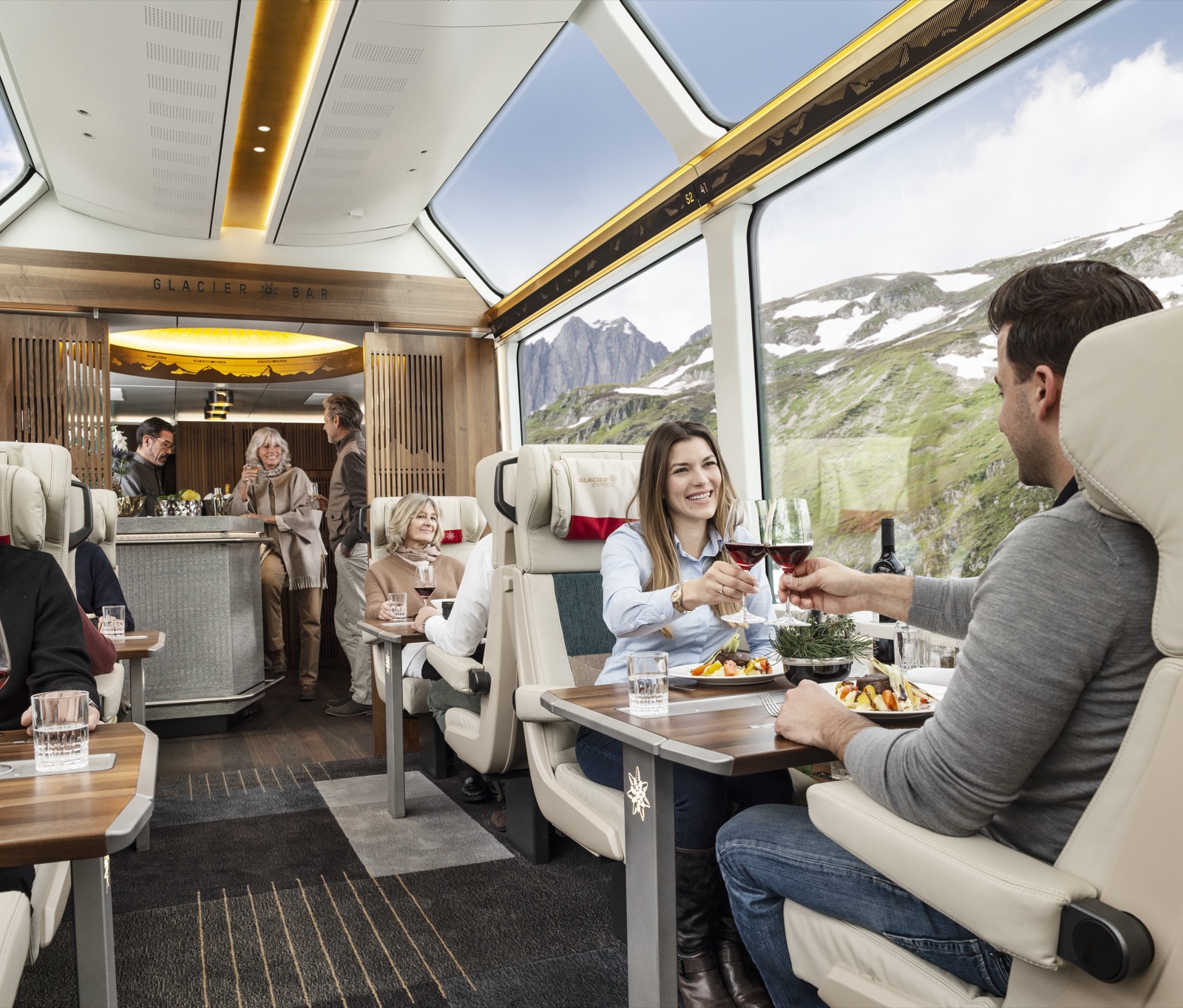 The Excellence Class dining table of the Glacier Express, the Alps in the panoramic glass