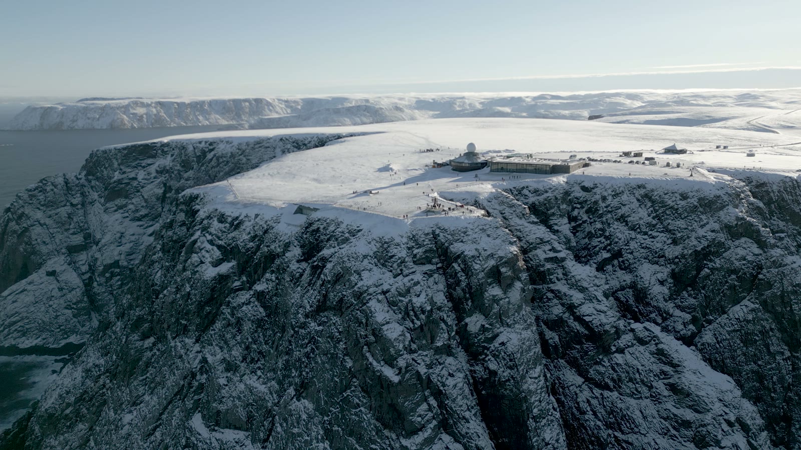 The snow-covered North Cape cliff and its plateau above the Arctic Ocean