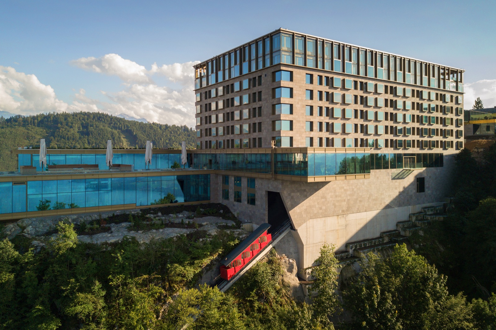 The Bürgenstock funicular arriving beneath the hotel and its cliffside pool