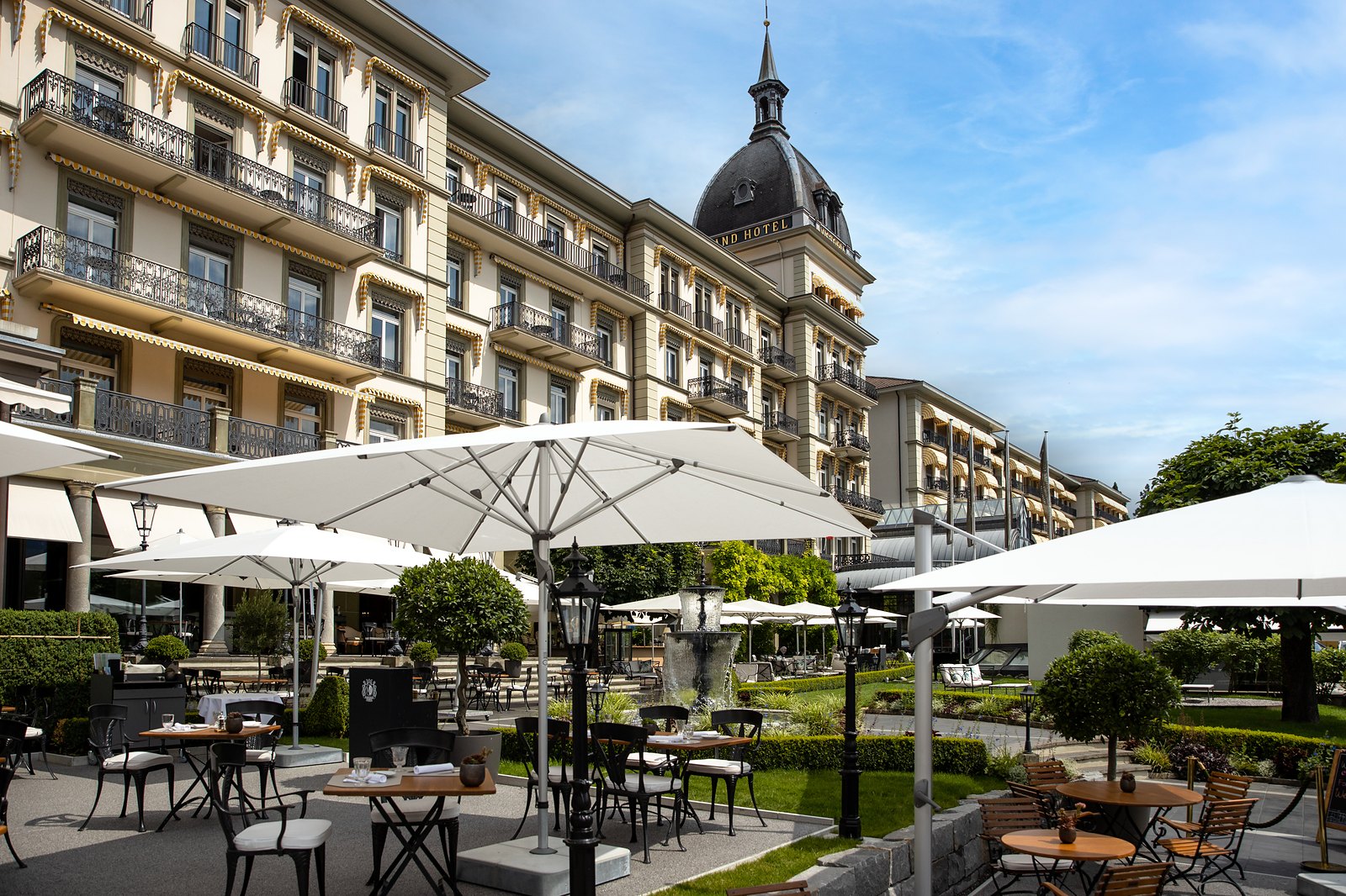 The Victoria-Jungfrau facade and garden terrace in summer, Interlaken