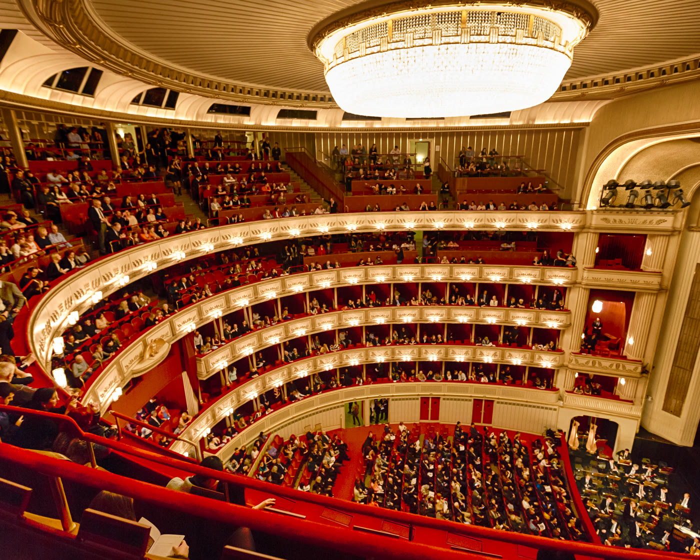 The gilded tiers and crystal chandelier of the Wiener Staatsoper auditorium